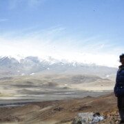 From Dingri Langkor’s sacred sky-burial site, Barbara Nimri has a clear view of the north glaciers of Chomolungma (Mt. Everest); 1985, Tibet.
